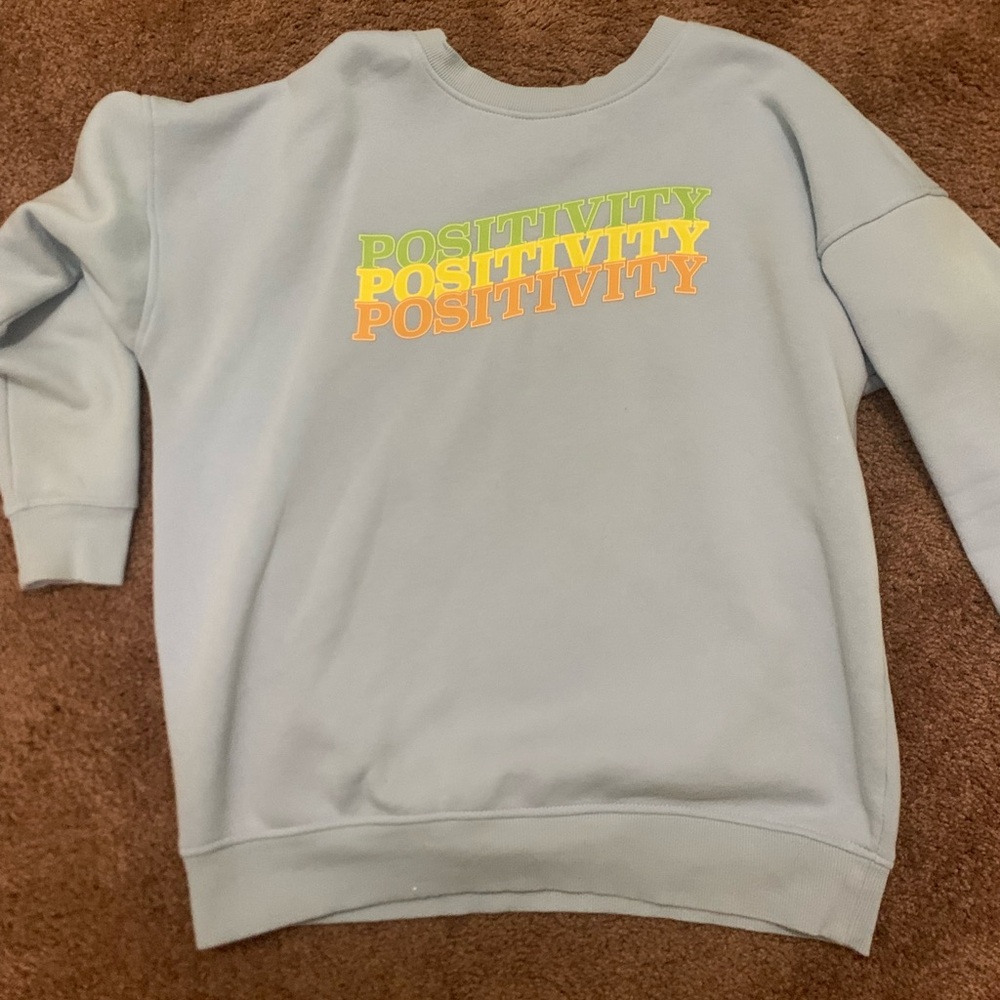 Light blue positivity sweater. Used once. Comfortable and light. By Abound